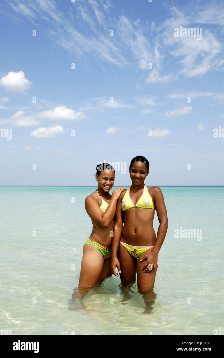 Cuba, Cubans, bikini, sea, stand, smile happily, the Caribbean, island, person, women, locals, swarthy, water, cooling, refreshment, friendly, friendship, friends, leisure time, bath pass, cloudy sky, Stock Photo