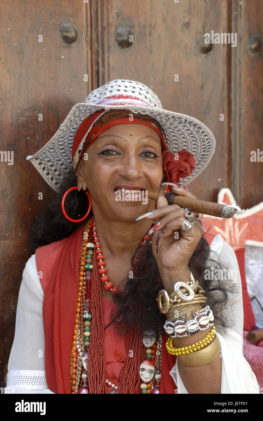Cuba, Havana, Cuban, cigar, smoke, portrait, the Caribbean, island, person, locals, woman, care, solar hat, headgear, jewellery, necklaces, arm catenas, bangles, cigar smoker, lifestyle, satisfaction, smoker, icon, luxury, tobacco products, consumption, mania, nicotine mania, nicotine, unhealthily, health risk, cancer danger, harmful, outside, life setting, health, Stock Photo
