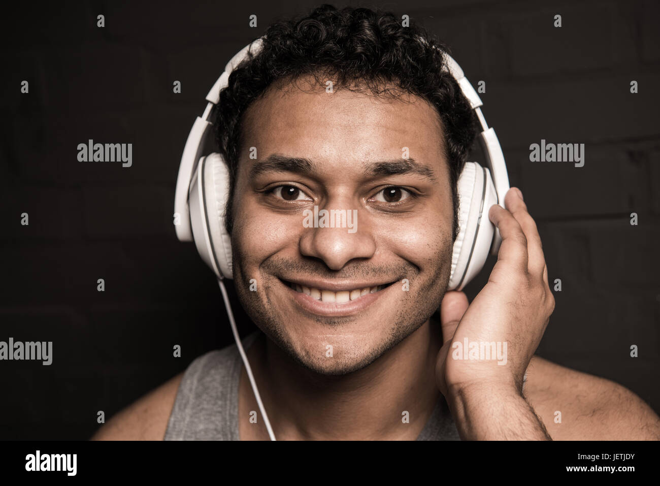 Portrait handsome black man listening hi-res stock photography and ...