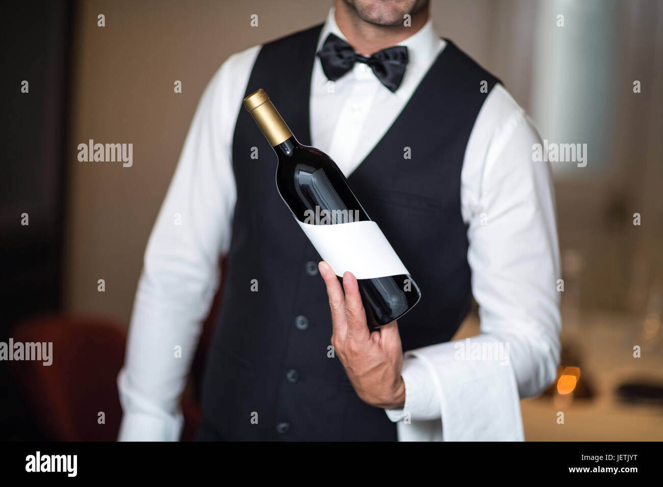 [Image: waiter-presenting-red-wine-JETJYT.jpg]