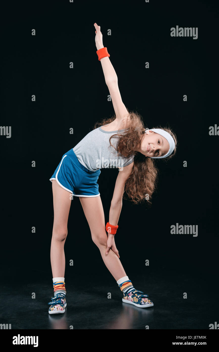 Girl In Sportswear Exercising Isolated On Black Acting Kids 12 Year girl-in-sportswear-exercising-isolated-on-black-acting-kids-12-year
