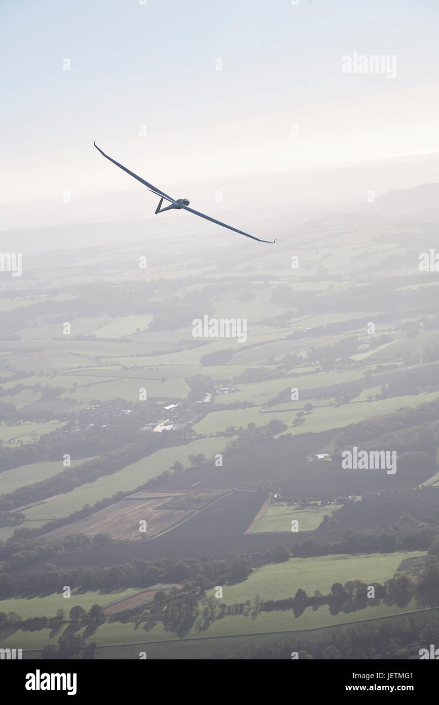High performance glider soaring through the blue sky Stock Photo Alamy