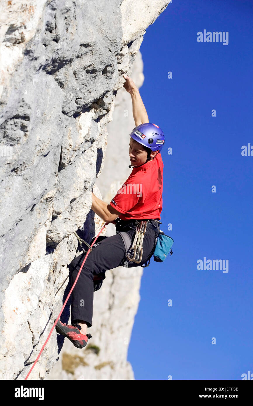 Man climbs in the mountain, Mann klettert am Berg Stock Photo
