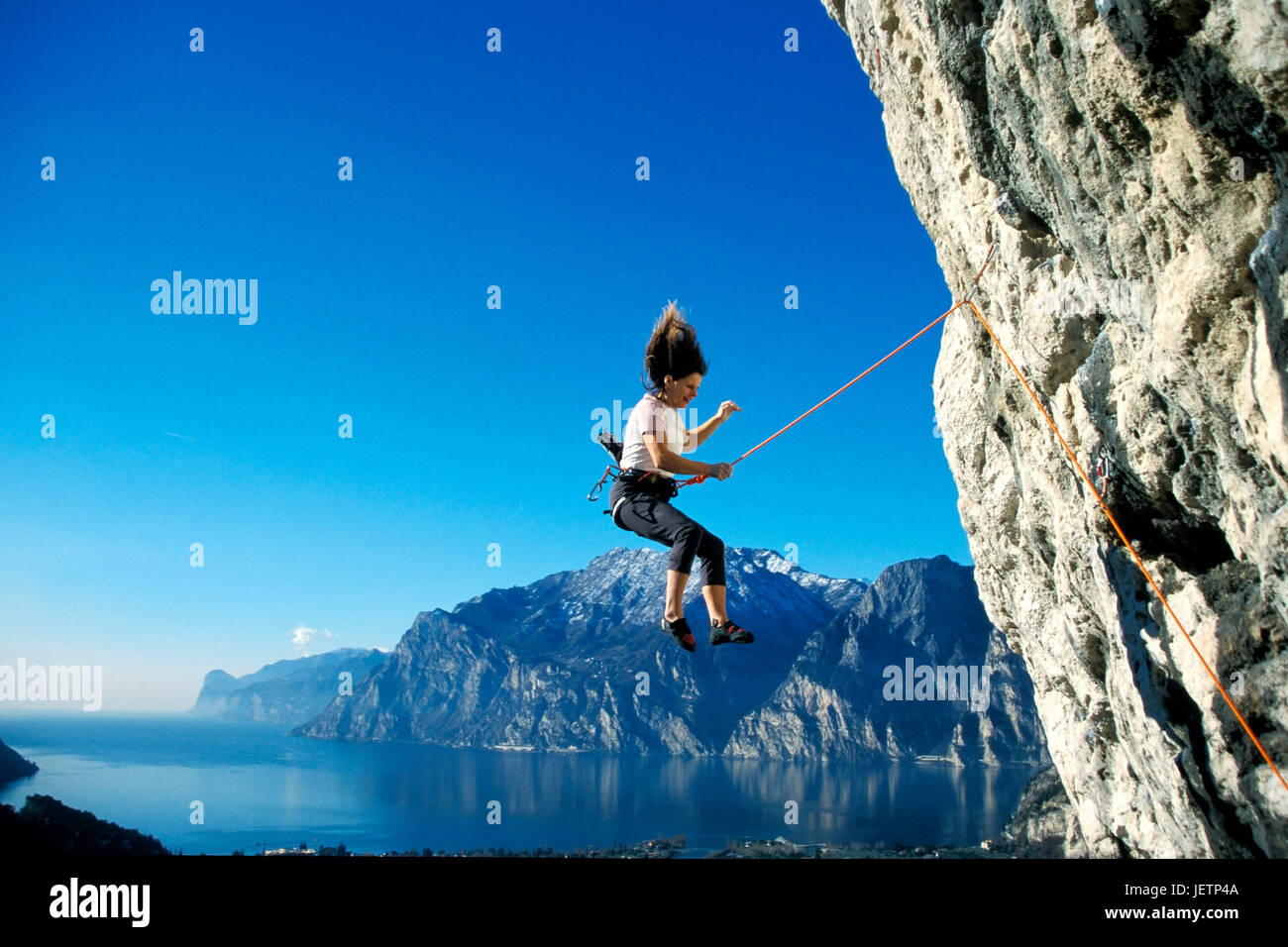 Woman climbs in the mountain, Frau klettert am Berg Stock Photo