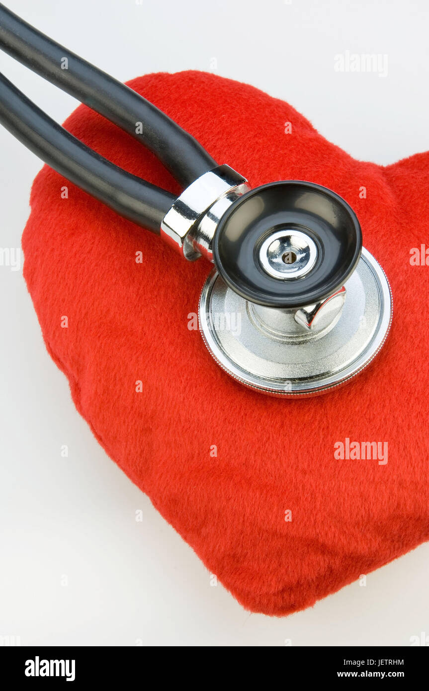 Stethoskop monitors a material heart, Stethoskop hoert ein Stoffherz ab Stock Photo
