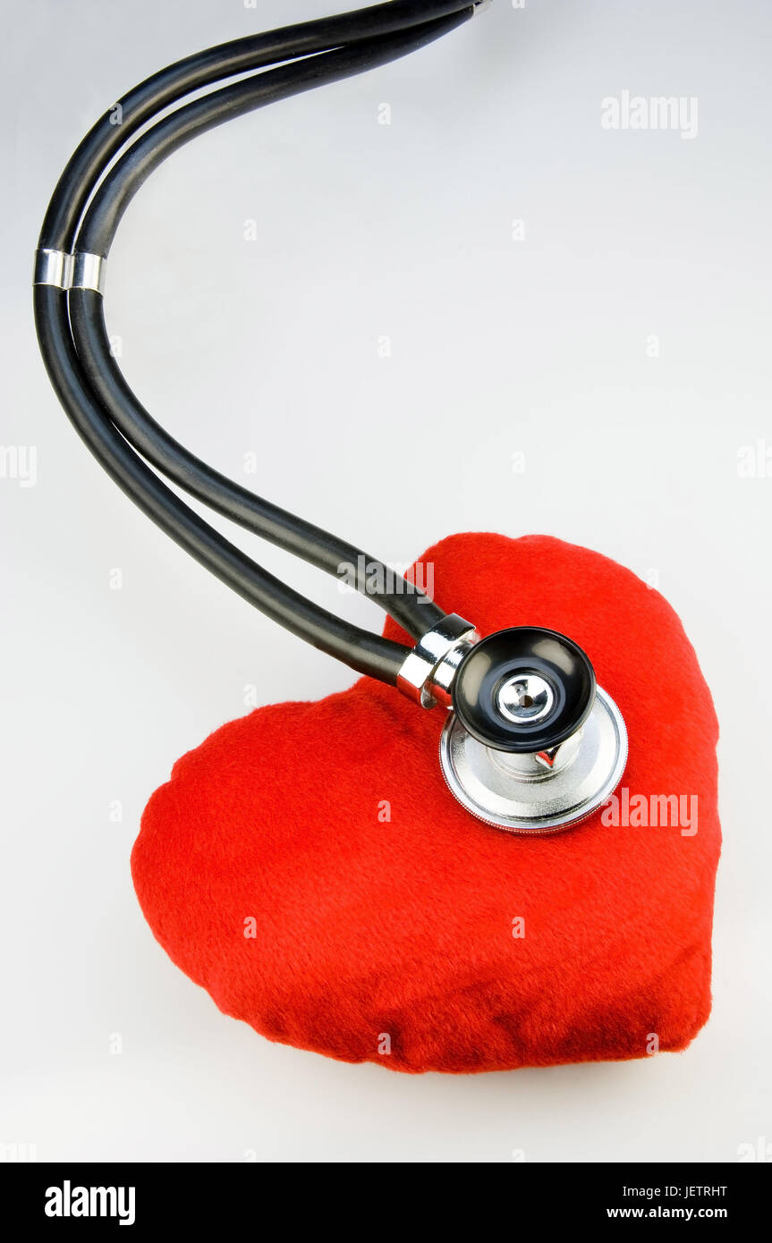 Stethoskop monitors a material heart, Stethoskop hoert ein Stoffherz ab Stock Photo