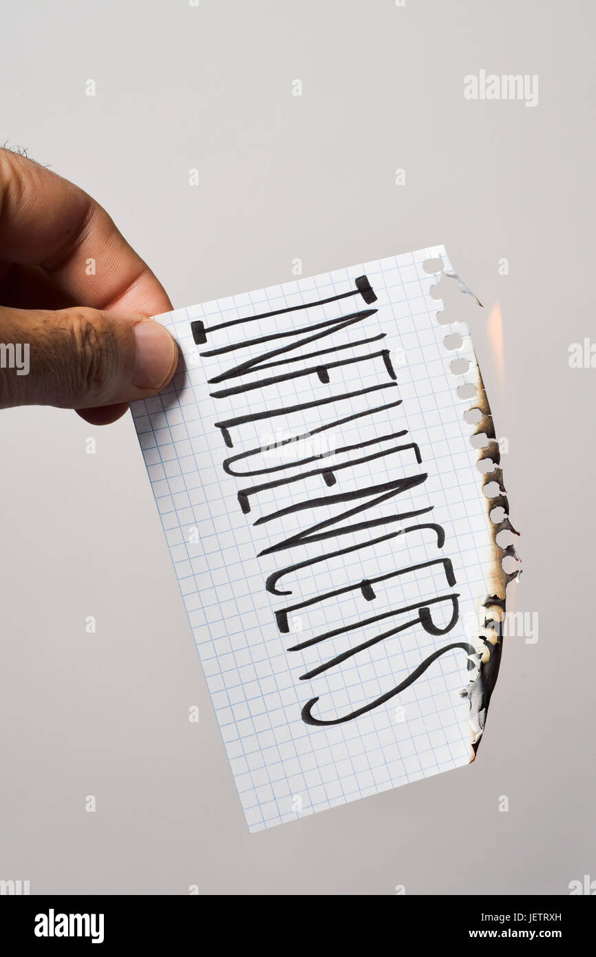 young man burning a piece of paper with the text influencers written in it Stock Photo