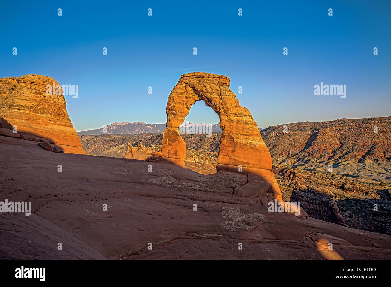 Delicate Arch at Sunset in Arches National Park in Utah Stock Photo