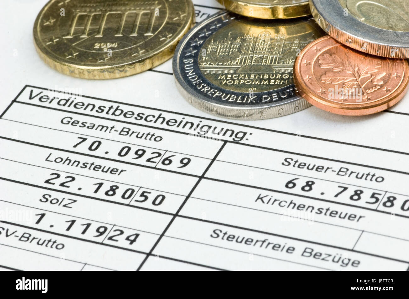 Pay slip form with euro-coins, Lohnabrechnungs-Formular mit Euro-Muenzen Stock Photo