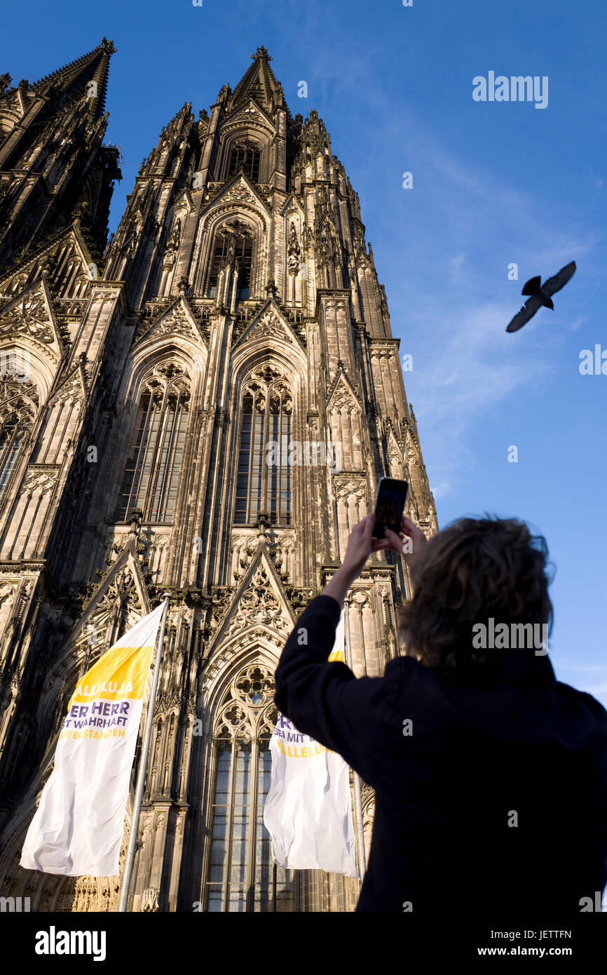 Tourist photographing Cologne cathedral Stock Photo