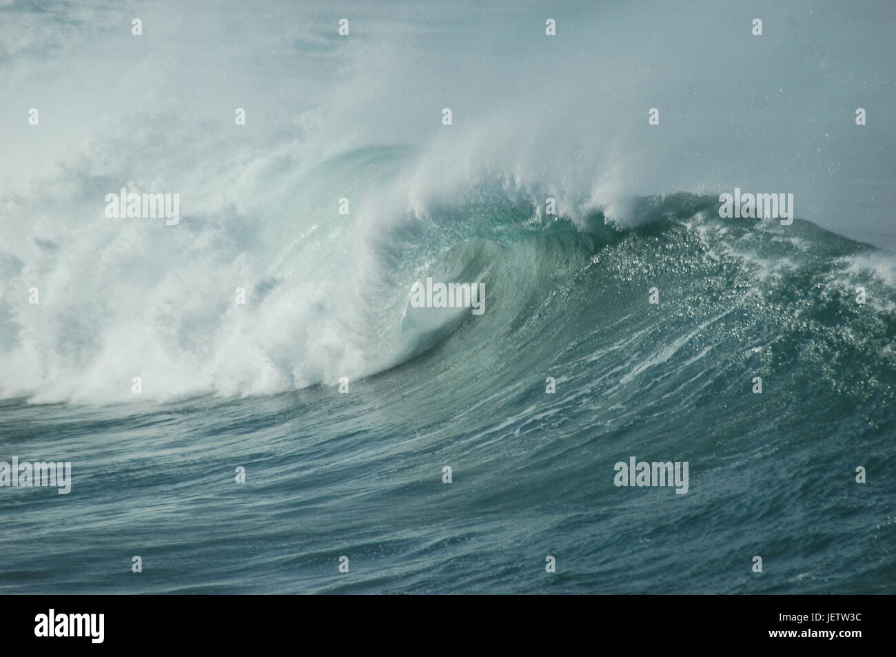 Surfs up on cornish beach wave barrel Stock Photo