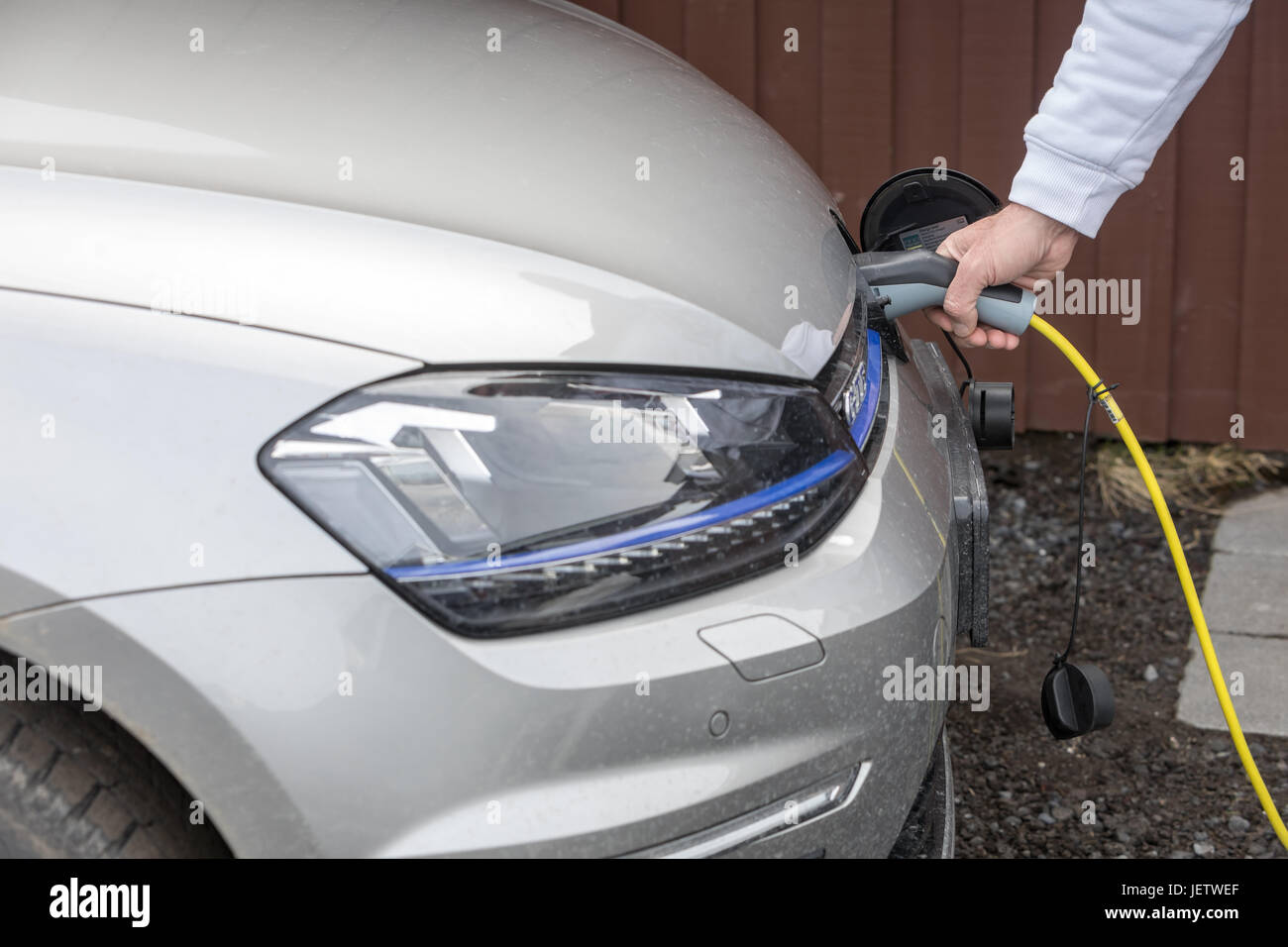 Vik, Iceland - Marsh 29, 2017: Charging An Electric Car With The Power Cable Supply Plugged In Stock Photo