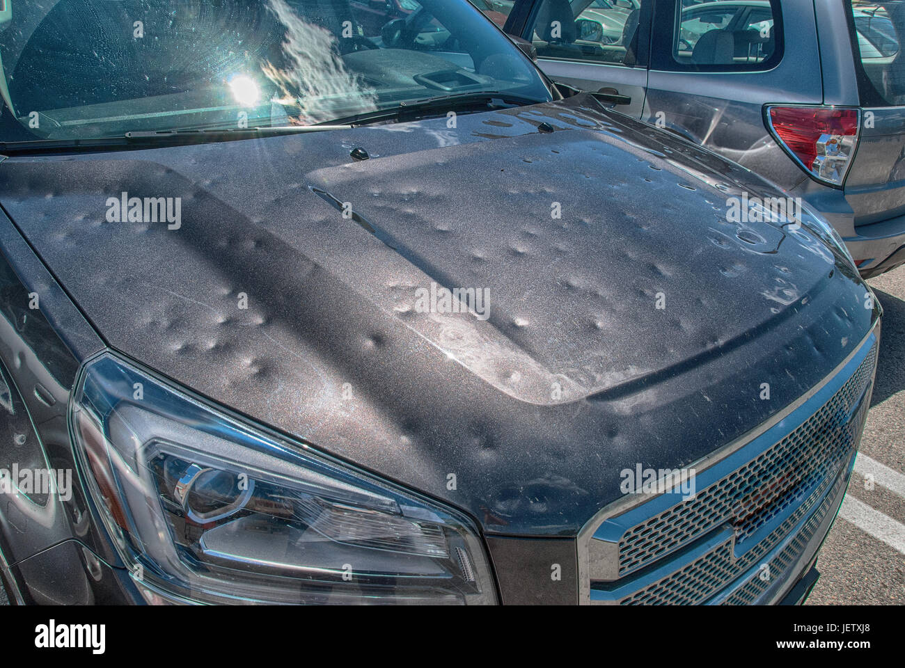 Dented car after a big hail storm Stock Photo
