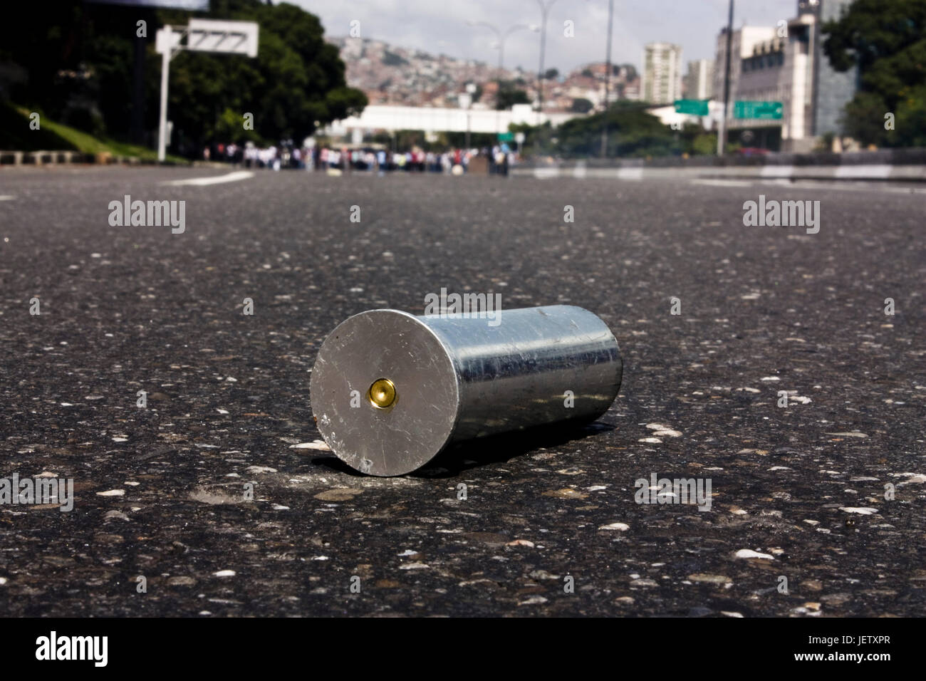 An empty tear gas canister over a highway in Caracas. Stock Photo