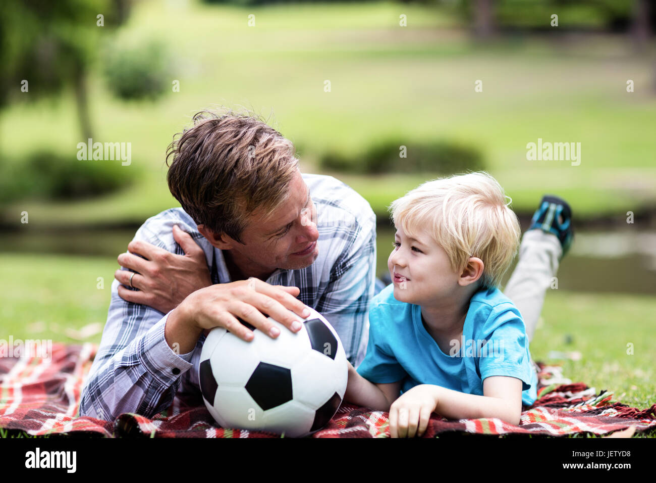 Father son relaxing in park hi-res stock photography and images - Alamy