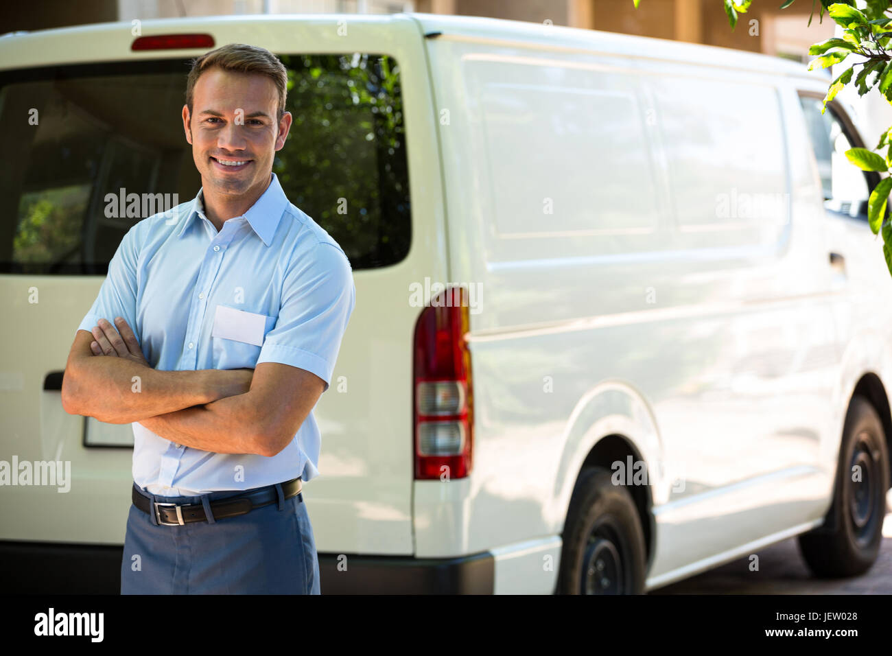 Handyman standing near his delivery van Stock Photo Alamy