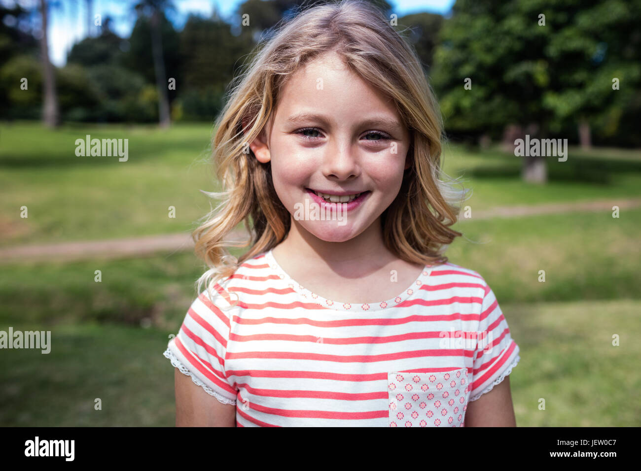 Portrait of happy girl smiling Stock Photo - Alamy