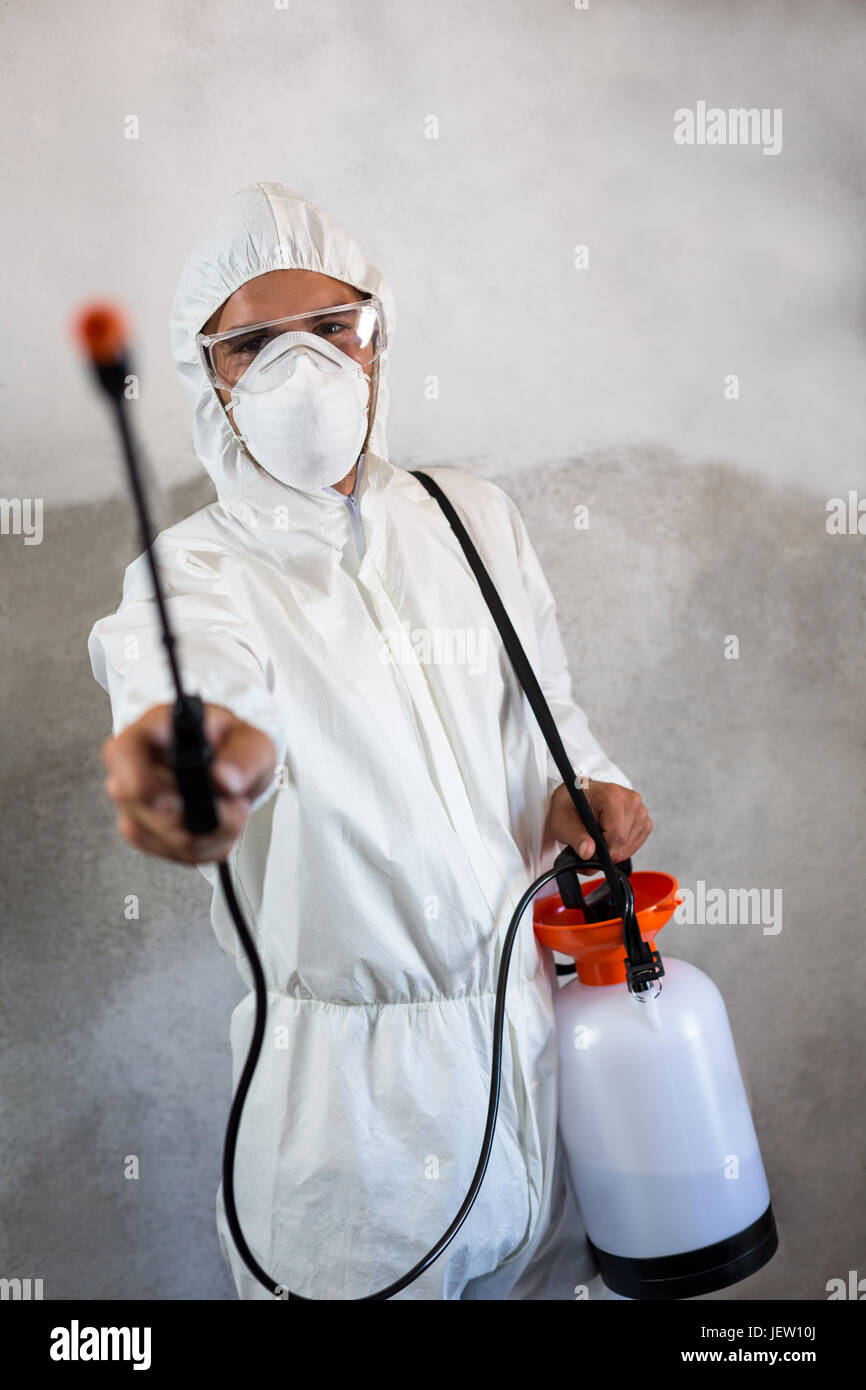 Portrait of manual worker holding crop spray Stock Photo