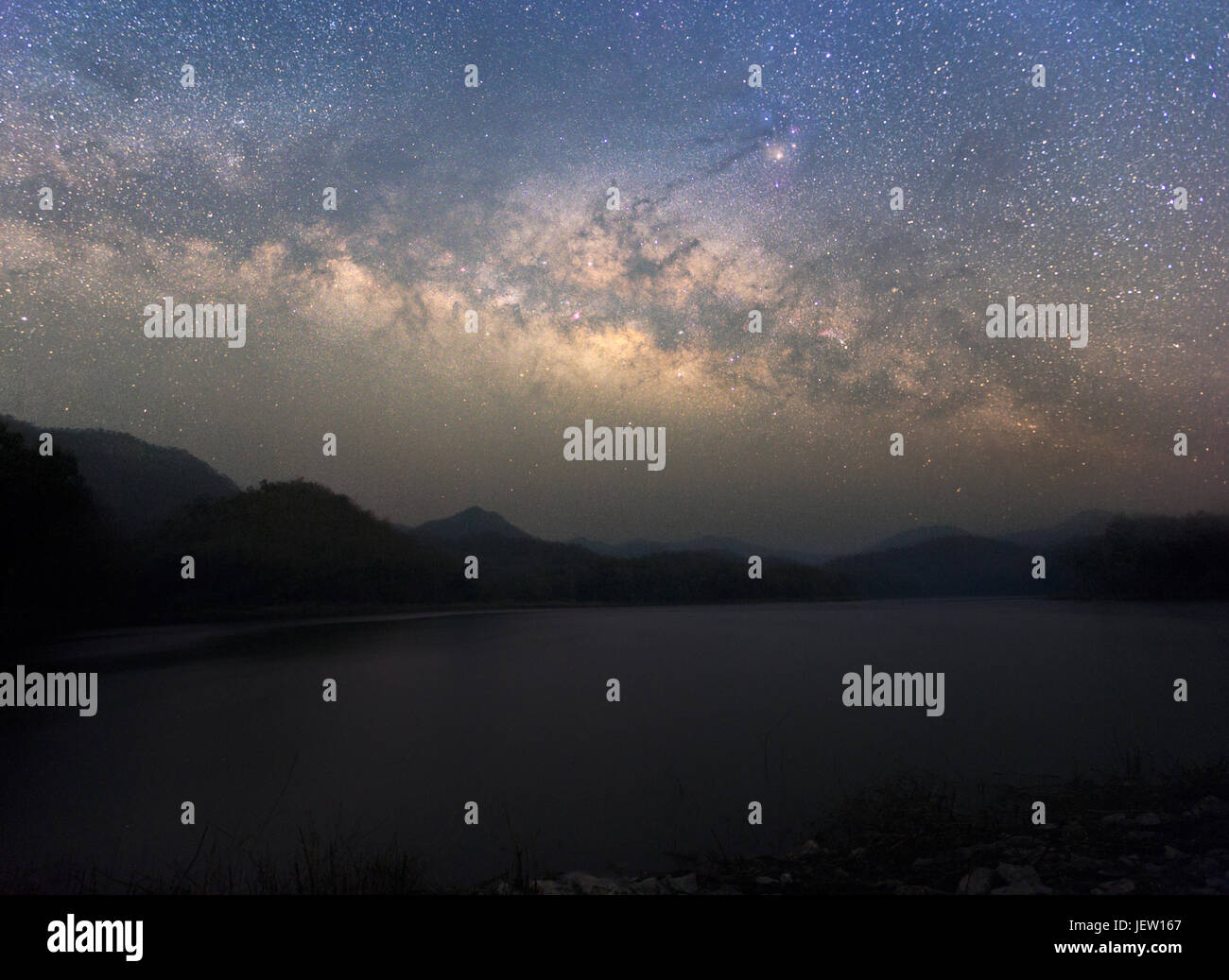 Beautiful Night Starry sky with Rising Milky Way over the mountain, Thailand Stock Photo
