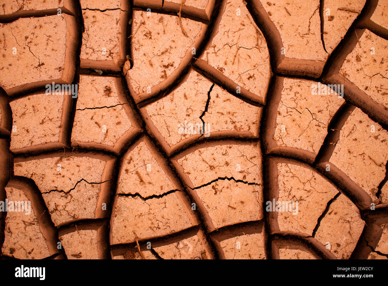 Desert cracks in dry, red clay Stock Photo Alamy