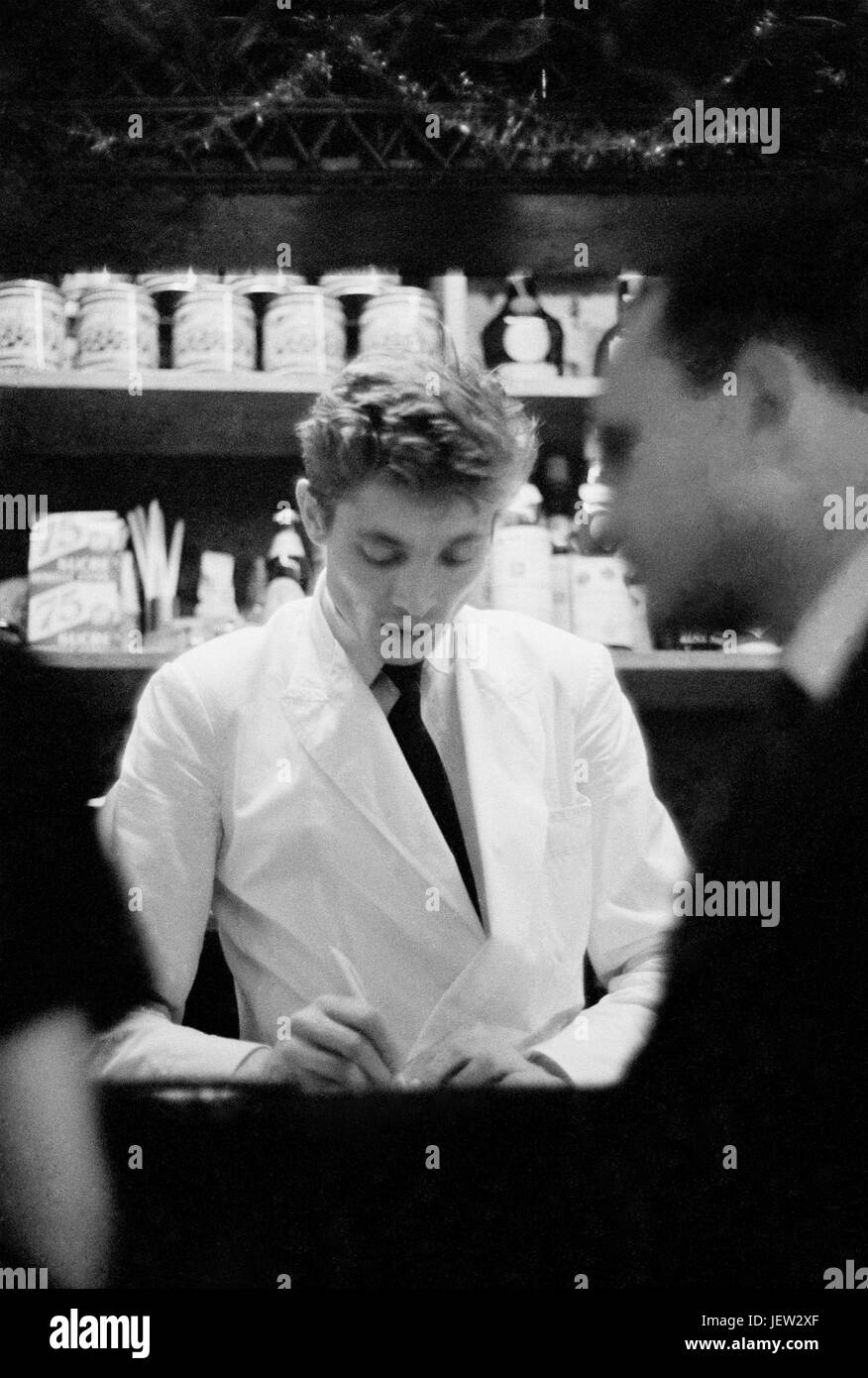 Waiter in a Paris restaurant. December 1958 Photo Michael Holtz Stock