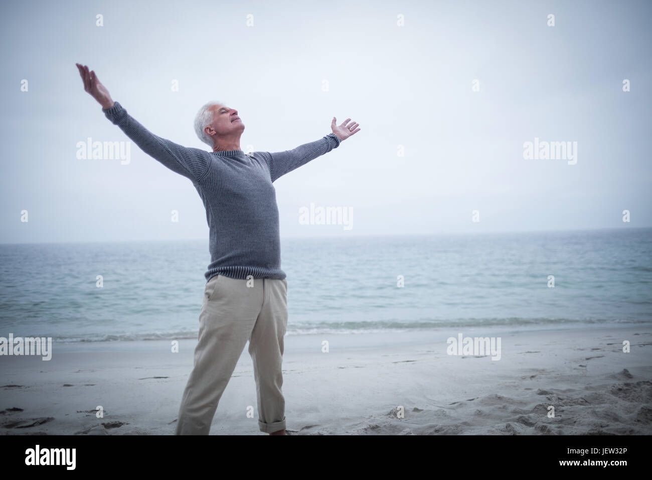 Carefree senior man arms hi-res stock photography and images - Alamy