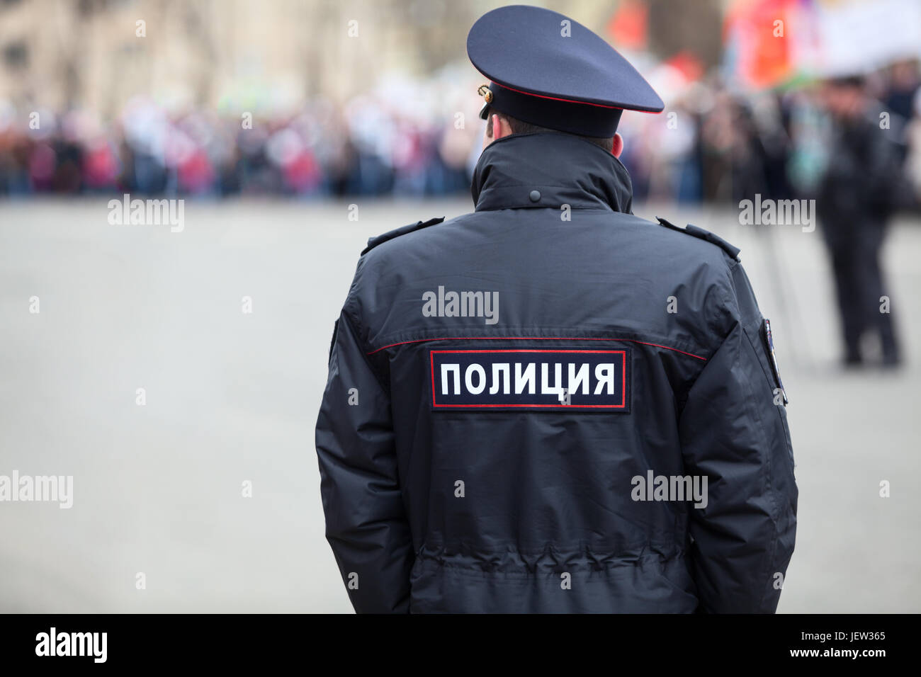 Russian policeman officer standing back to camera with inscription Police  on the uniform jacket, Russia, copyspace Stock Photo - Alamy
