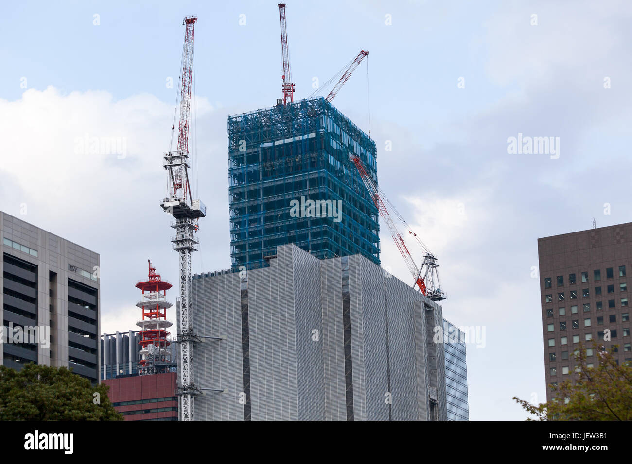 TOKYO, JAPAN - CIRCA APR, 2013: Yomiuri Shimbun Tokyo Headquarters building is under construction. The Marunouchi is a central commercial district of  Stock Photo