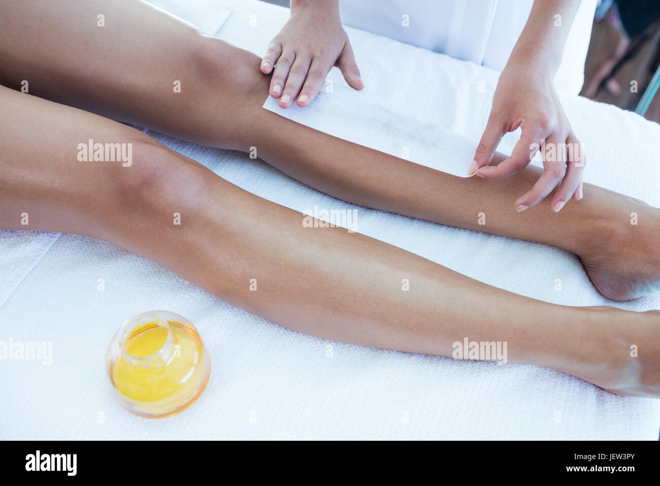 Woman getting her legs waxed Stock Photo