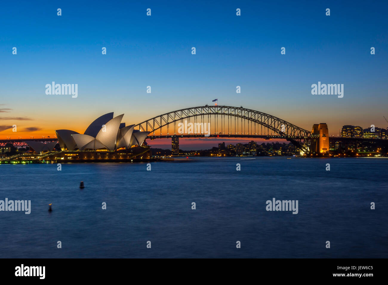View on Sydney Opera house and harbour bridge at sunset Stock Photo - Alamy