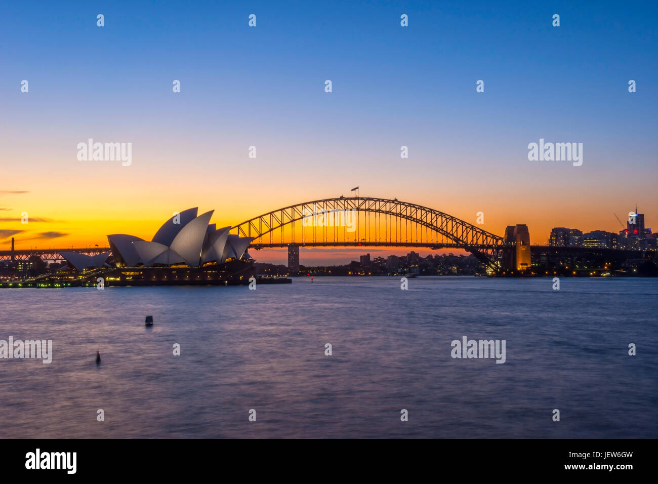 View on Sydney Opera house and harbour bridge at sunset Stock Photo - Alamy