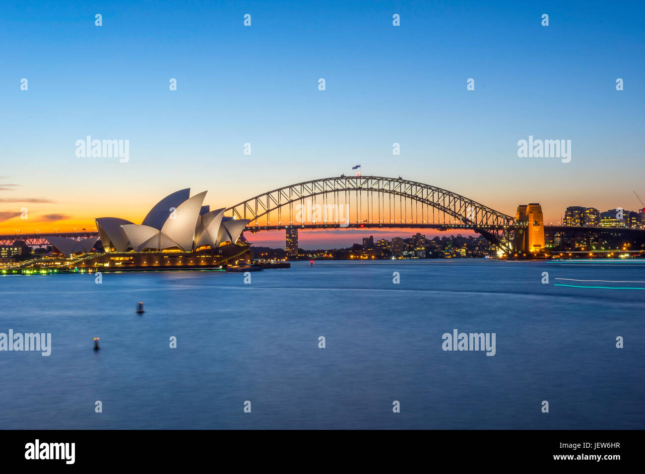 View on Sydney Opera house and harbour bridge at sunset Stock Photo - Alamy