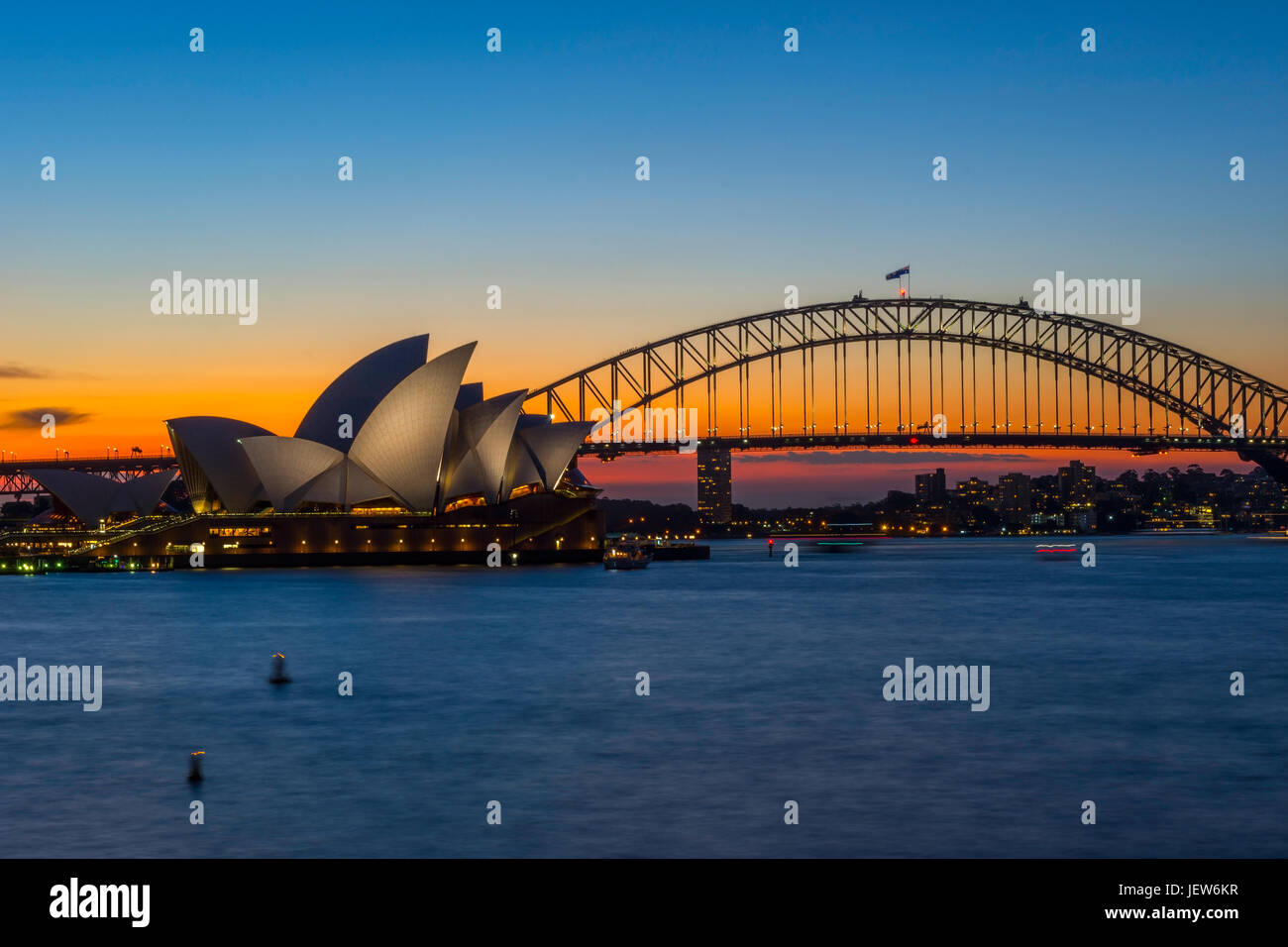 View on Sydney Opera house and harbour bridge at sunset Stock Photo - Alamy