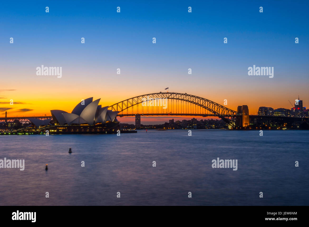 View on Sydney Opera house and harbour bridge at sunset Stock Photo - Alamy