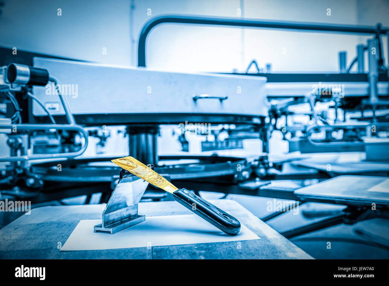 Print screening metal machine. Industrial printer. Print manufacture. Stock Photo