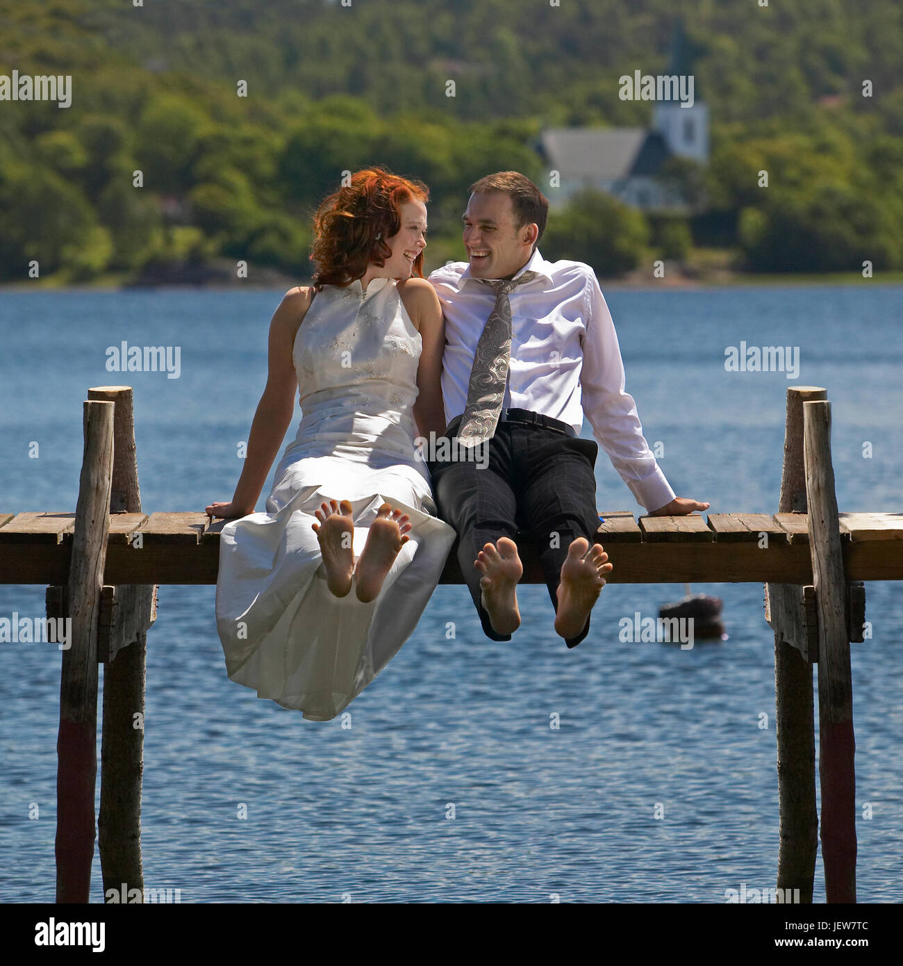 Happy bridal couple at water Stock Photo