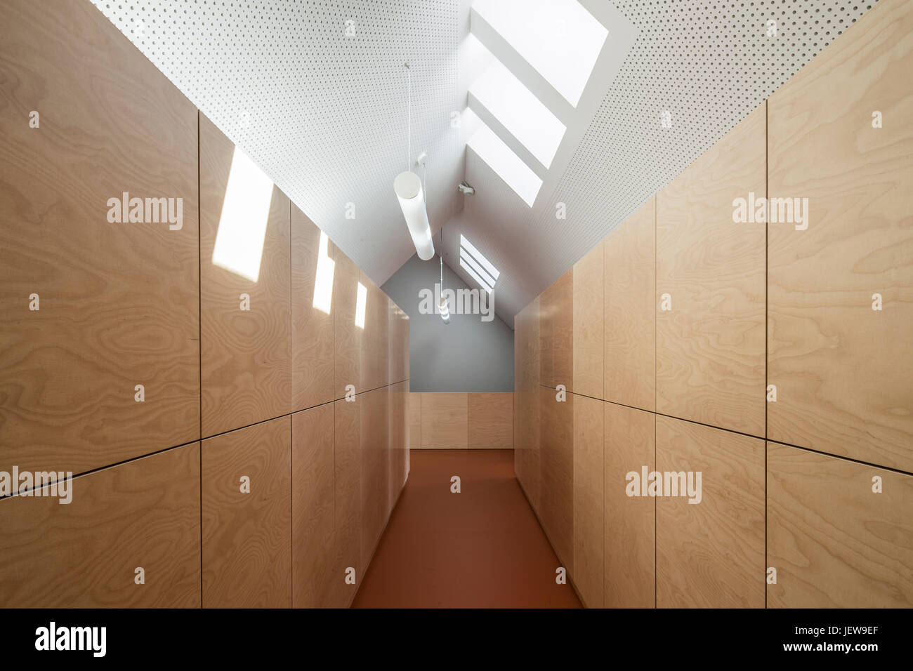 Corridor with storage shelving. Kindergarten Mitte Kyritz, Kyritz, Germany. Architect: kleyer koblitz letzel freivogel, 2016. Stock Photo