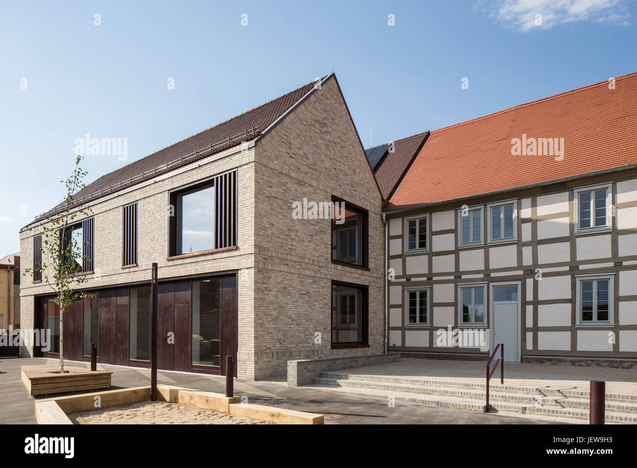 Juxtaposition of old and new with exterior courtyard. Kindergarten