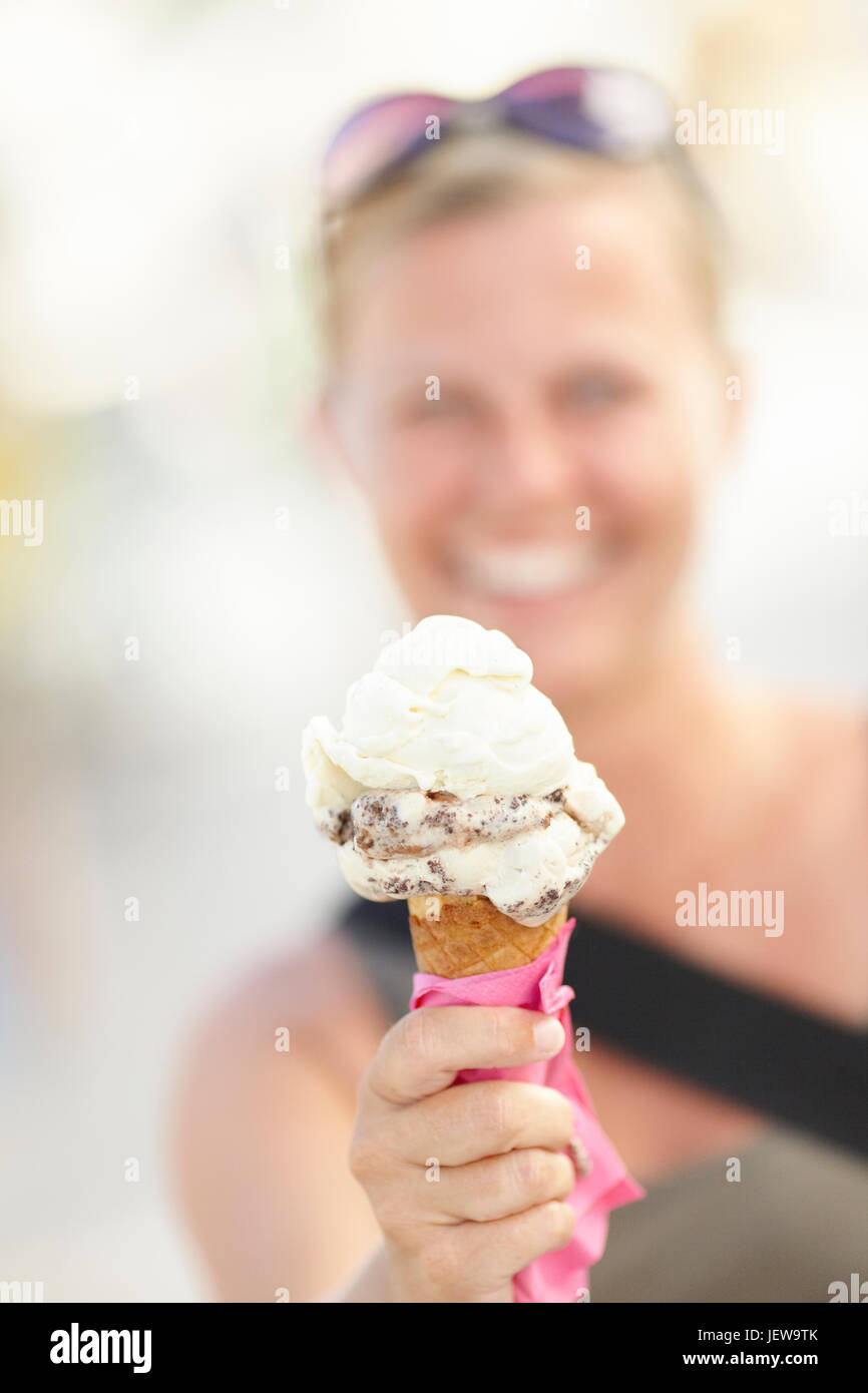 Woman holding ice cream cone Stock Photo Alamy
