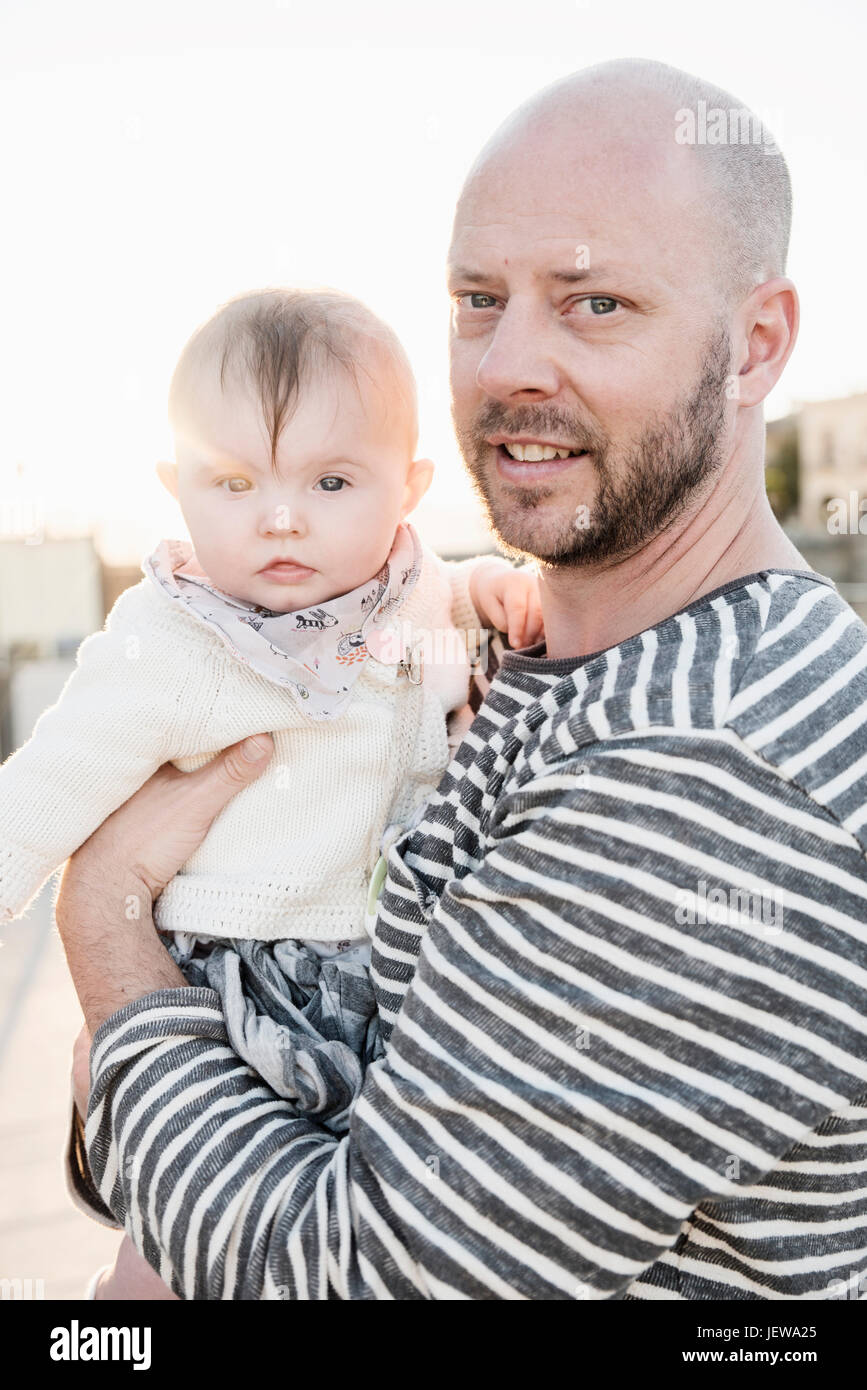 Father holding baby girl Stock Photo Alamy
