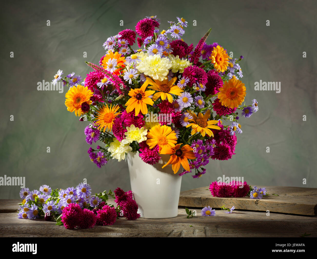 Bouquet of flowers with sunflowers and asters. Stock Photo