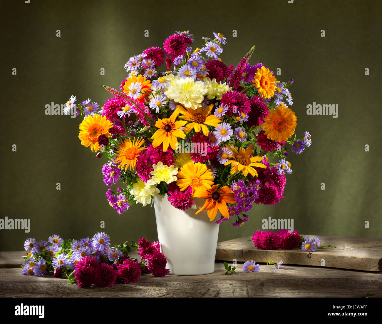 Bouquet of flowers with sunflowers and asters. Stock Photo