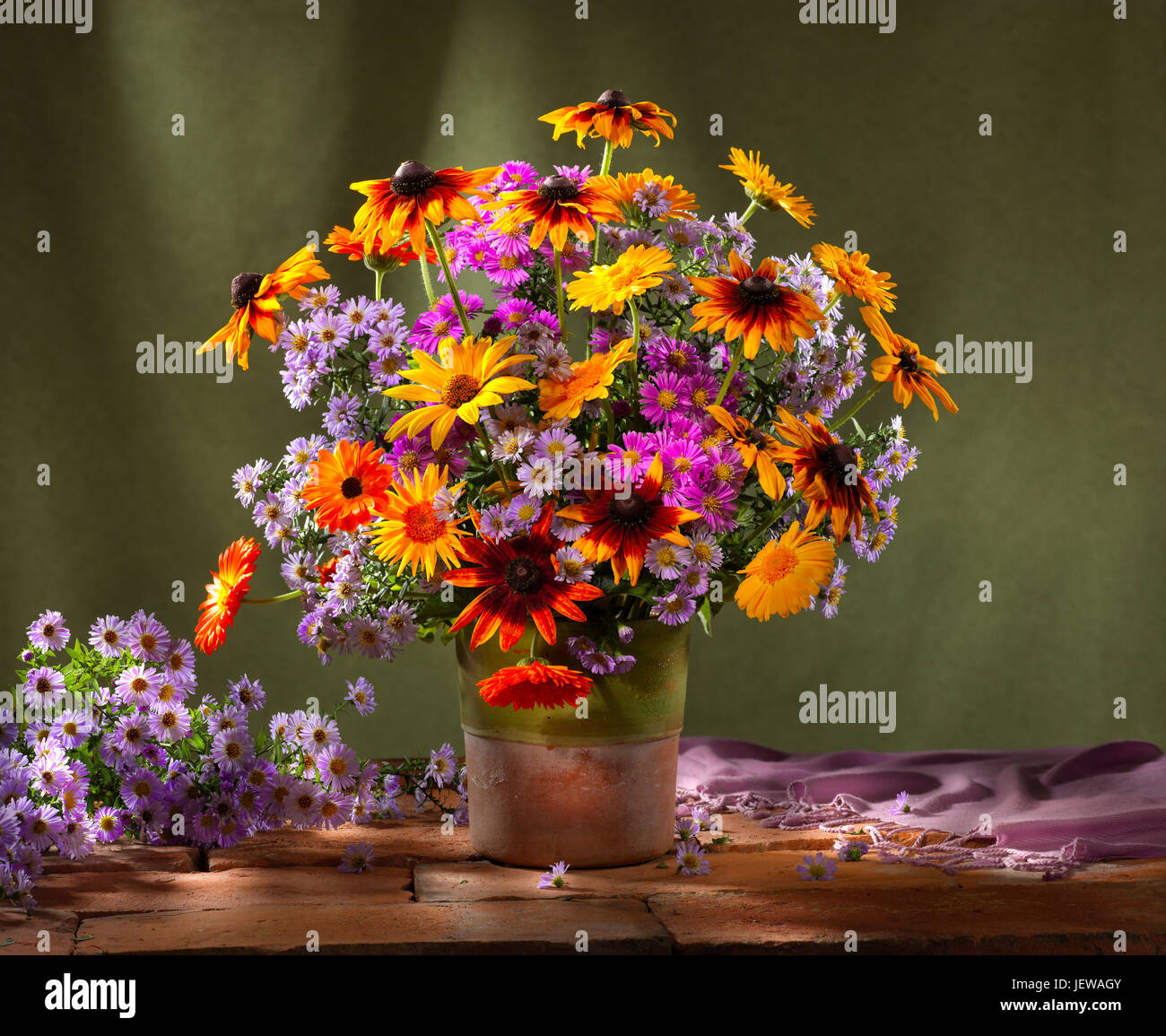 Bouquet of flowers with sunflowers and asters. Stock Photo