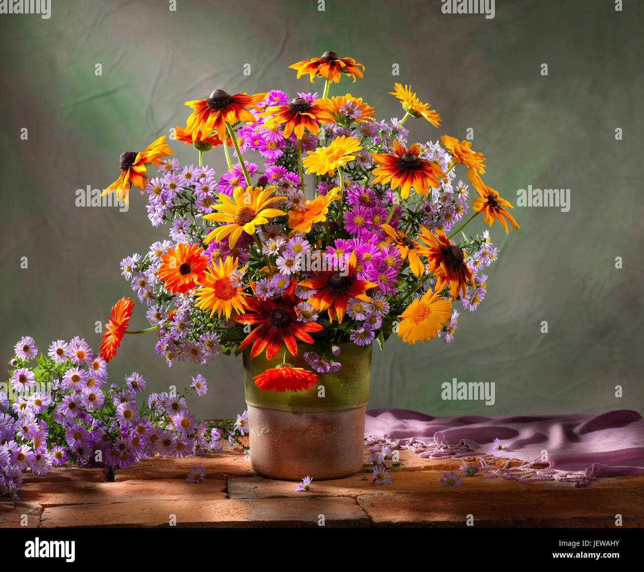 Bouquet of flowers with sunflowers and asters. Stock Photo