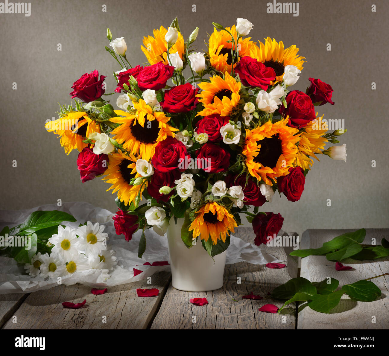 Bouquet of flowers with sunflowers and roses. Stock Photo