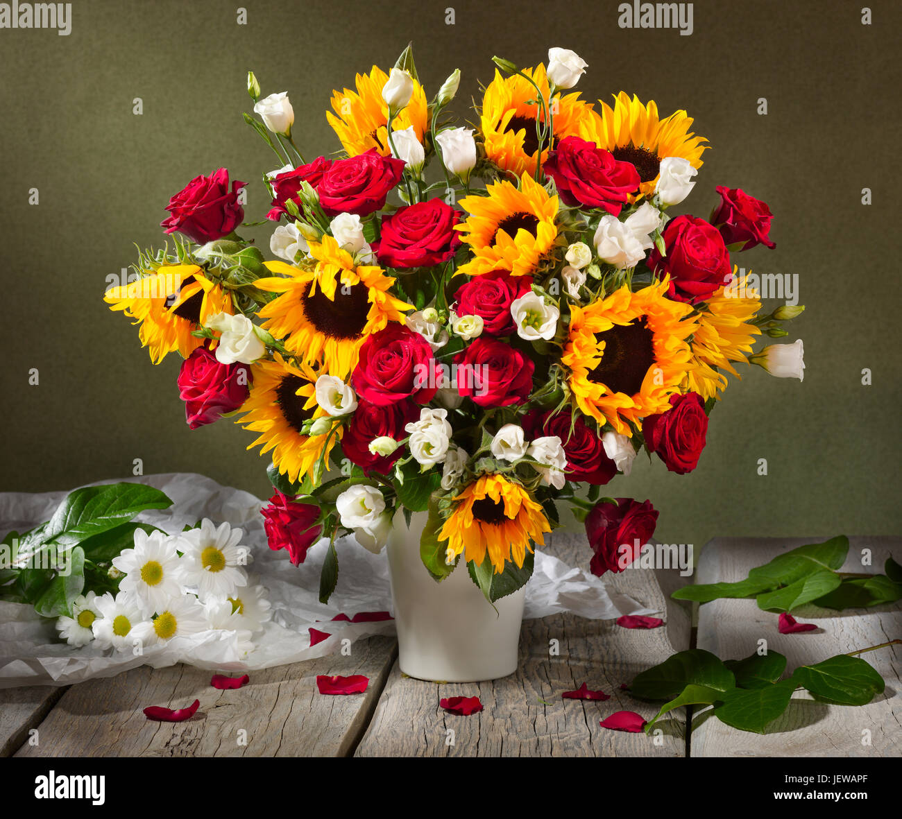 Bouquet of flowers with sunflowers and roses. Stock Photo