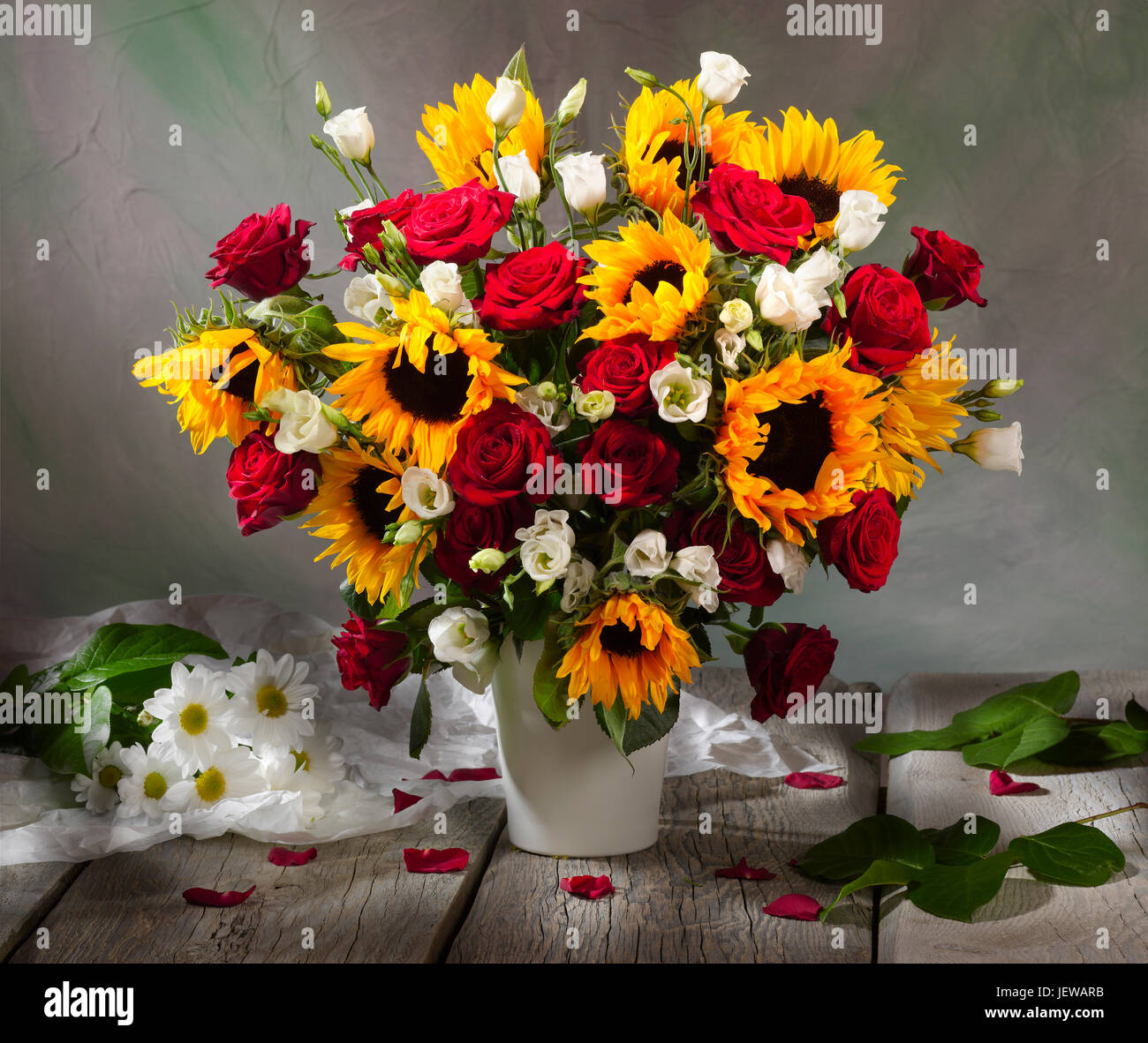 Bouquet of flowers with sunflowers and roses. Stock Photo