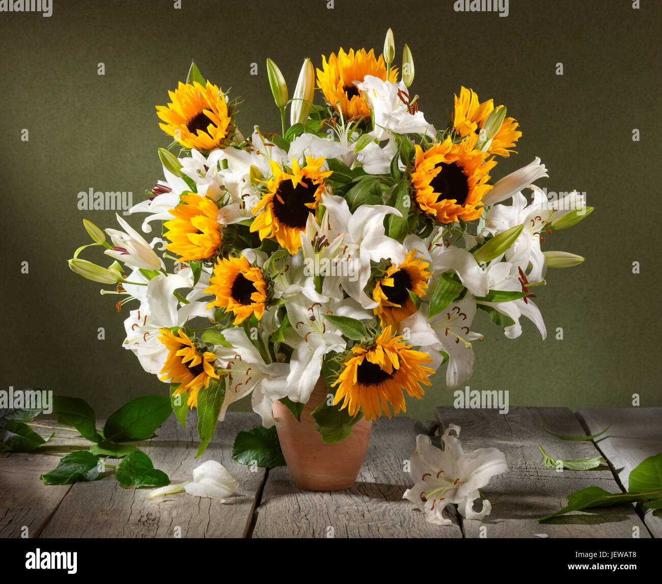 Bouquet of flowers with sunflowers and lily. Stock Photo