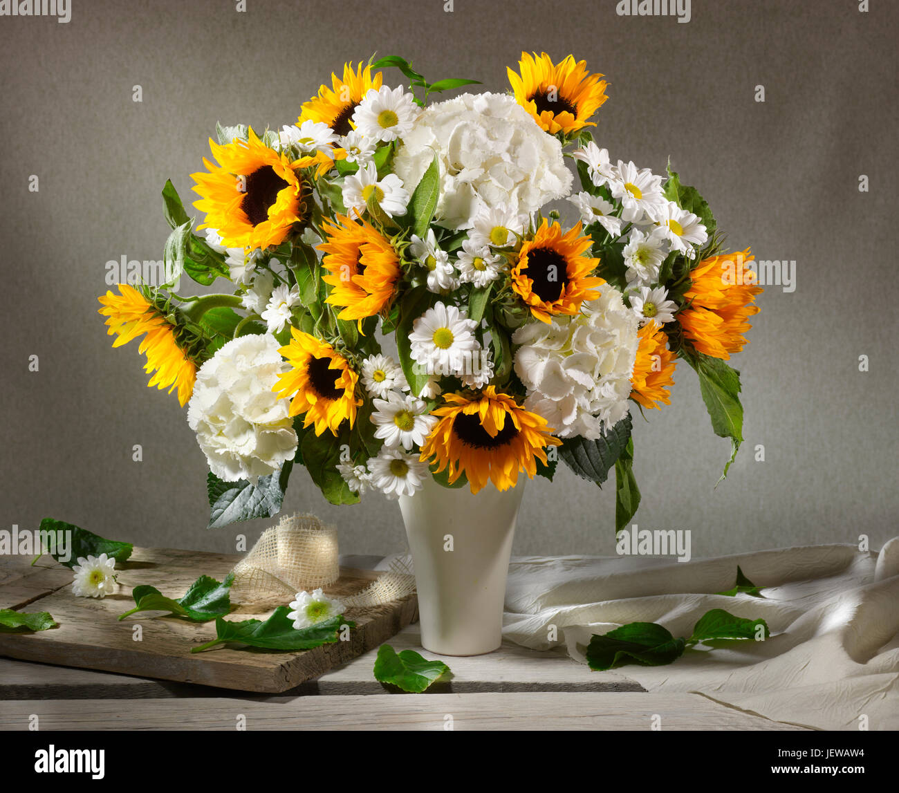 Bouquet of flowers with sunflowers and hydrangeas. Stock Photo