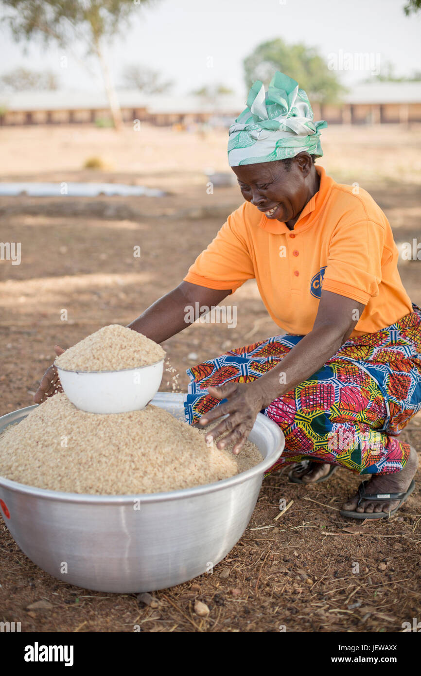 A women’s cooperative processes and parboils rice as an activity in UpperEast